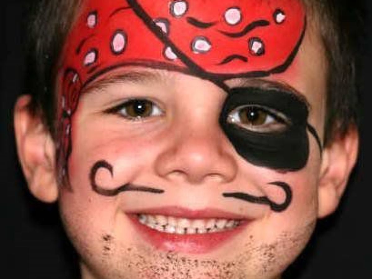 a child with face painting of a pirate