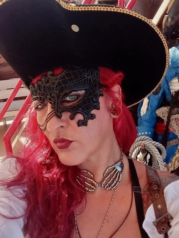 Cut Throat Kali a woman wearing a hat