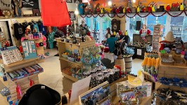 Pirate-themed gift shop with assorted costumes, toys, and decorations.