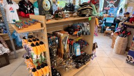 Shop interior with pirate-themed costumes, toys, and souvenirs.